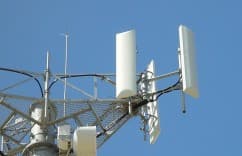 Cell tower against a clear blue sky