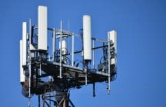 Cell tower against a clear blue sky