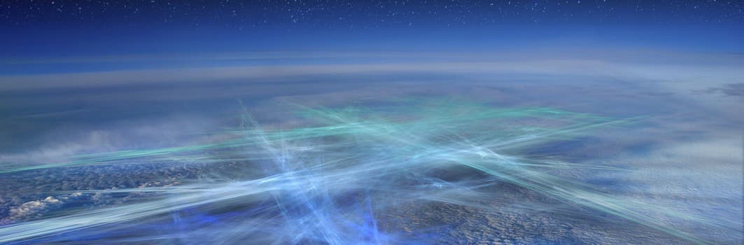 Abstract design of blue and green light swirls on a dark background.