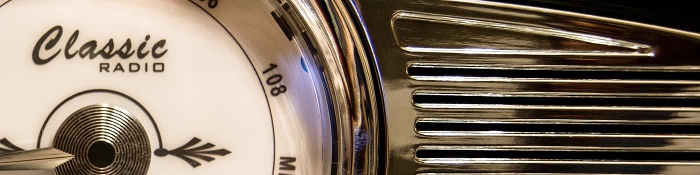 Close-up of a vintage radio dial with 'Classic' label and frequency at 108 MHz